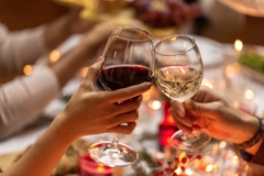Image Two people celebrate with drinking red and white wine.