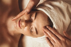 woman with a head towel getting a massage