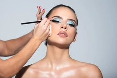Image latina woman getting her makeup done
