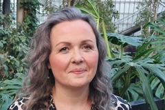Image Headshot of woman against greenery