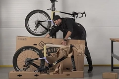 Image A man is removing the bike packaging made by Mondi.