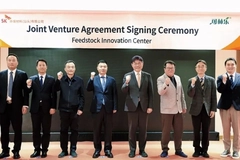 Company representatives posing for picture.
