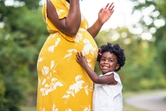 Image African pregnant woman with child