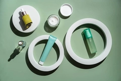 skin care products on a green table
