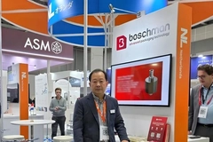 Image A person standing in front of a booth