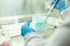 Image hand of scientist in lab with blue gloves