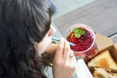 A person drinking from a straw