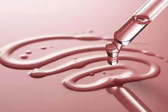 Image clear liquid cosmetic formulation on pink background