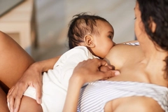 Image Close-up of young black mother breastfeeding baby