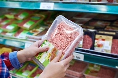 Image person holds mince meat packaging
