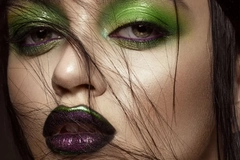 Woman with green styled makeup