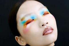 Woman with pale face and color makeup