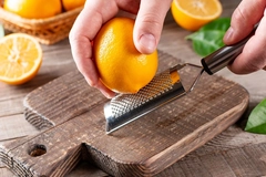 Image hand with knife and lemon