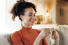 woman eating chocolate bar