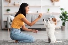 Woman giving a dog treats