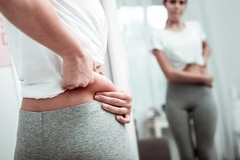 Image Woman examining her body fat