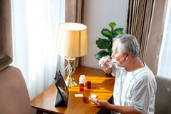 Male patient taking supplement