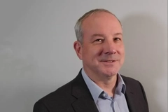 A man smiling into the camera