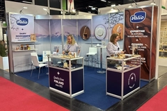Image two women at a trade show booth