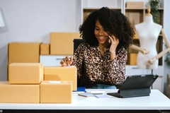 Woman with e-commerce packaging boxes.