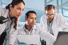 Image Scientists looking at a computer