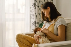 woman breastfeeding her baby