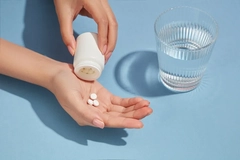 Image Woman taking supplements