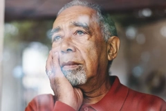 older man looking out the window