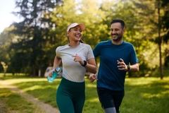 Man and woman running outside