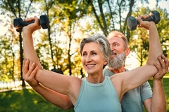 Middle aged woman lifting weights