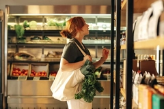 woman looking at groceries