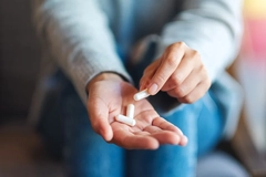 Woman taking supplements Woman taking supplements