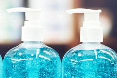 A close-up of a couple of blue liquid bottles
