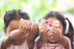 kids holding candy in their hands