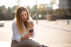 Young woman eating chocolate.