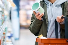 Image A person holding a container and a basket