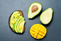 Image Avocado on toast next to mango
