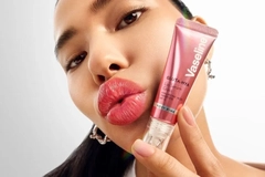 Image Woman posing with lip gloss product