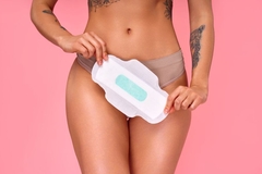 Image person holds pad in front of crotch