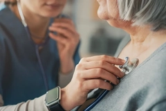 Image woman with cardiovascular disease being examined by doctor