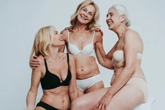 Image Three older women smiling in their underwear.