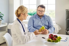 Obese man with dietician