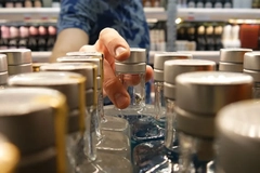 A person holding a bottle