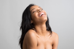 Image woman throws head back in laughter