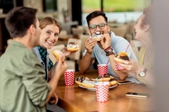 Image People eating donuts.