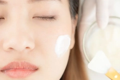 woman getting skin care applied