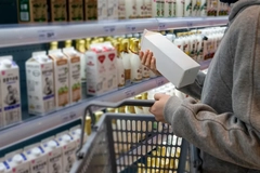 consumer choosing milk