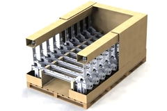 Image A cardboard box with metal parts inside
