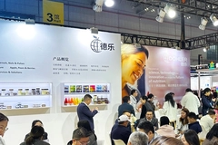 busy trade show booth with people