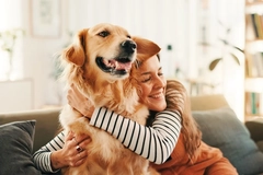 Image Woman hugging her golden retriever